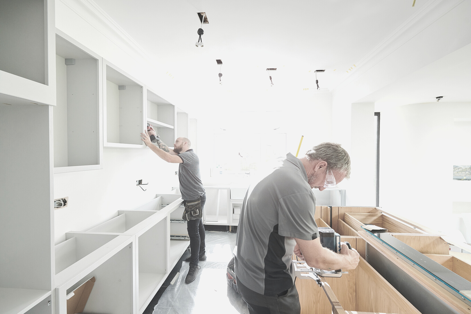 joinery team fitting a kitchen